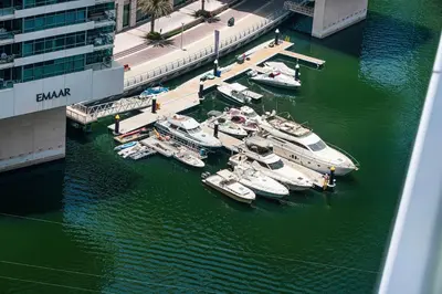a group of boats are docked in a harbor at High-Floor Marina View - Balcony, Pool and Gym in Dubai