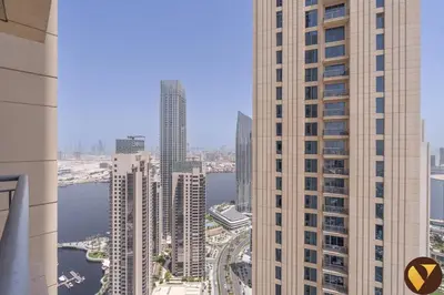 an aerial view of a city with tall buildings at Vogue Creek Harbour, Harbour Views Tower Waterfront Living Close to Downtown, Burj Khalifa and Dubai Mall, One Bedroom Apartment with Balcony and Canal View, Access to all Amenities in Dubai