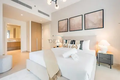 a white bedroom with a large white bed in a room at Lagoon and Beach Access, Near Festival City Mall, Mins From Downtown Dubai, Rosewater at Creek Beach Building 2, Creek Beach by Deluxe Holiday Homes in Dubai