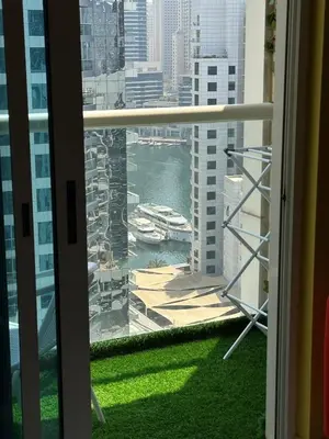 a window with a view of a harbor at Livincci - Luxury Studio in Dubai Marina - 16 in Dubai