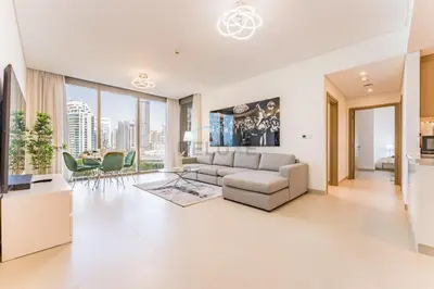 a living room with a couch and a table at Short walk to Marina Walk and JBR Beach, close to Bluewaters Island and Ain Dubai, 5242 Tower 1, Dubai Marina by Deluxe Holiday Homes in Dubai