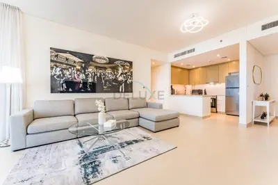a living room with a couch and a glass table at Short walk to Marina Walk and JBR Beach, close to Bluewaters Island and Ain Dubai, 5242 Tower 1, Dubai Marina by Deluxe Holiday Homes in Dubai