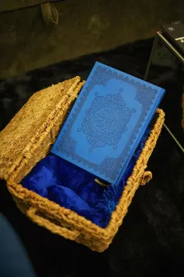 a book sitting in a basket on a table at Luxury High floor apartment Atlantis & palm view in Dubai