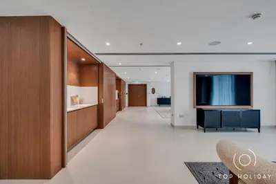 a hallway of a hotel with a television on the wall at Luxury High floor apartment Atlantis & palm view in Dubai