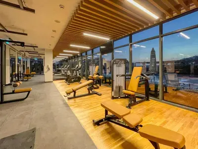 an empty gym with a view of the city at GuestReady - Golden paradise in Dubai Hills in Dubai