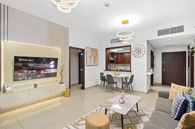a living room with a couch and a table at White House With Burj Views, Free Parking in Dubai