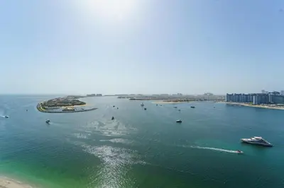 an aerial view of a large body of water with boats at Elie Saab Tower Luxury Apartment in Dubai