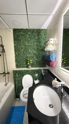 a bathroom with a sink and a toilet and a tub at Livincci - Luxury 1 Bed Apartment in JLT-10 in Dubai