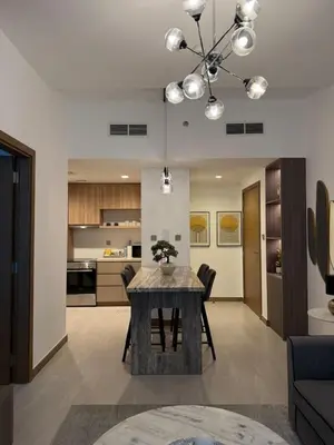 a kitchen and living room with a dining room table at Canal View 1BR - Business Bay - Fully Furnished in Dubai
