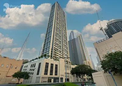 a tall building in the middle of a city at New Luxe 2BR in Burj Royale, 1 Min Walk to Dubai Mall,40th Floor, Burj Khalifa View Pool, Wifi, Gym in Dubai
