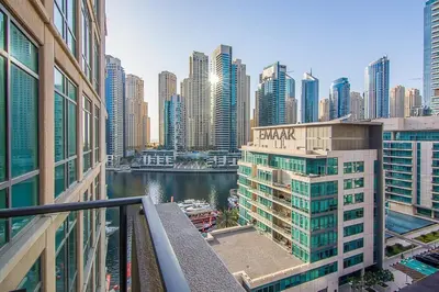 a view of a city with a river and buildings at Modern 1BR with Balcony and Marina Views in Al Majara 2 in Dubai