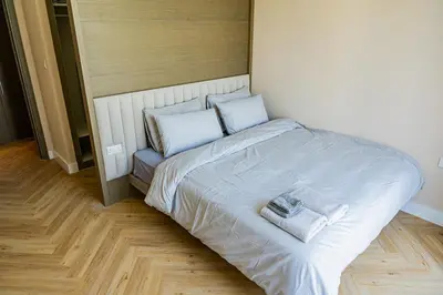 a bed with two towels on it in a room at Creek Harbour Skyline Burj Khalifa & Sea View in Dubai