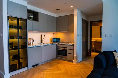 a kitchen with a sink and a microwave at Creek Harbour Skyline Burj Khalifa & Sea View in Dubai
