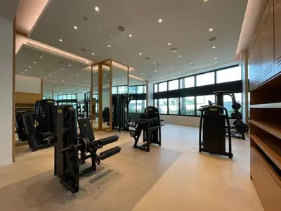 a gym with treadmills and machines in a building at Address Beach Resort - 1BDR With Private Beach in Dubai