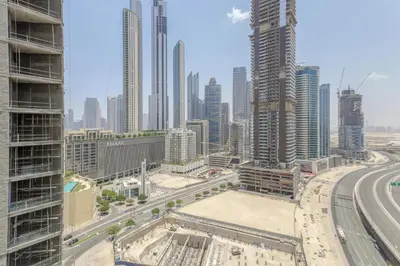 a view of a city skyline with tall buildings at Apartment in Downtown As Dormitory Room for male in Dubai