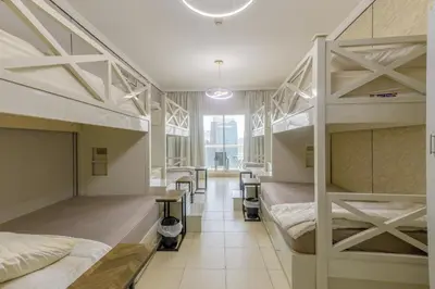a room with two bunk beds and a hallway at Apartment in Downtown As Dormitory Room for male in Dubai