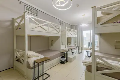 a room with two bunk beds and a window at Apartment in Downtown As Dormitory Room for male in Dubai