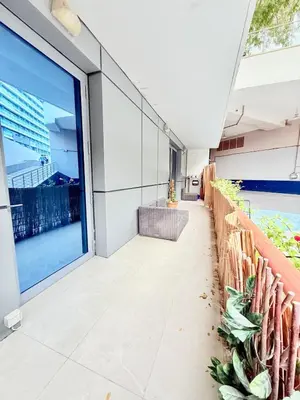a building with a balcony with a large window at Oceana Residences Holiday Beach Home in Dubai