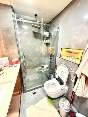a small bathroom with a shower and a toilet at Oceana Residences Holiday Beach Home in Dubai