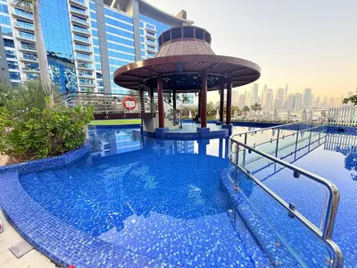 a swimming pool with a gazebo on top of a building at Oceana Residences Holiday Beach Home in Dubai