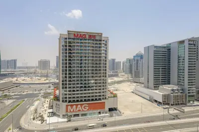 a large building with a msg sign on it in a city at Apartment in Downtown As Dormitory Room for female in Dubai
