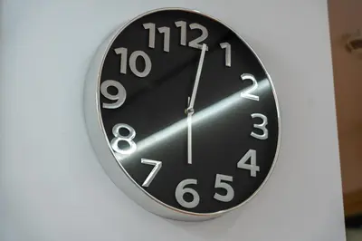 a clock is hanging on a wall at Luxury 1BR Suite I Boulevard View I Downtown Dubai in Dubai