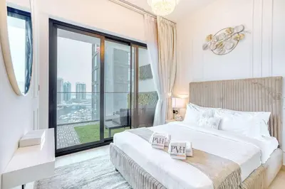 a bedroom with a large bed and a large window at PVH - Exquisite 1BR With Canal View - Binghatti Canal, Business Bay in Dubai
