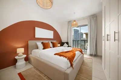 a bedroom with a large bed and a large window at Downtown Gem, 1 BDR Apartment, Walk to Dubai Mall & Burj khalifa in Dubai