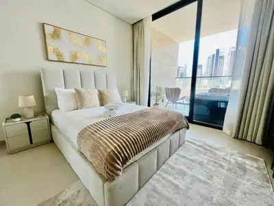 a bedroom with a large bed and a large window at Business Bay Studio Jacuzzi & Iconic View in Dubai