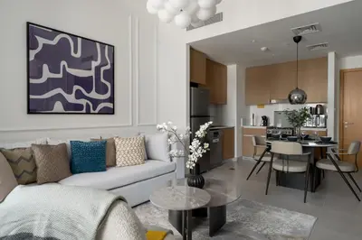 a living room with a couch and a table at Maison Privee - Serene Hideaway with Top Facilities in Creek Beach in Dubai
