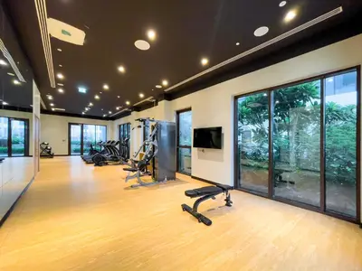 a gym with treadmills and exercise equipment in a room at Maison Privee - Serene Hideaway with Top Facilities in Creek Beach in Dubai
