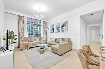 a living room with a couch and chairs at Modern 2BR at Burj Crown Walk to Burj Khalifa by Vibel Stay in Dubai