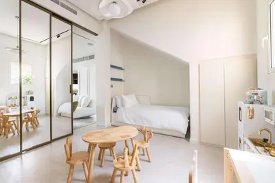 a room with a table and chairs and a bed at Luxury Villa with Pool and Garden 4BR The Springs in Dubai