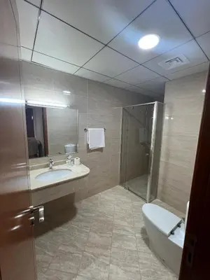 a bathroom with a tub and a sink and a shower at Wonderful Rental Apartments in Dubai Silicon Oasis in Dubai