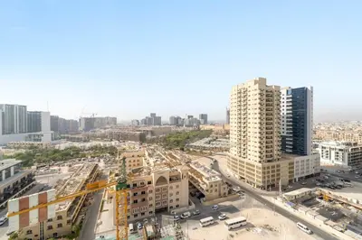 an aerial view of a city with tall buildings at Silkhaus New 1BDR Retreat at Binghatti Tulip in JVC in Dubai