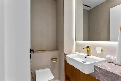 a bathroom with a sink and a toilet at Elegant 1 Bedroom in Binghatti Tulip - JVC in Dubai