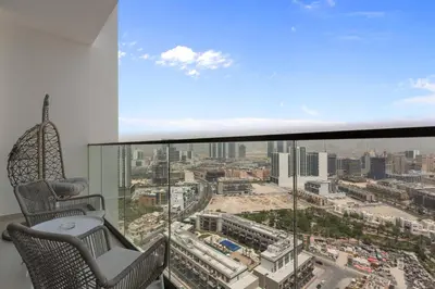 a room with a view of a city at Elegant 1 Bedroom in Binghatti Tulip - JVC in Dubai