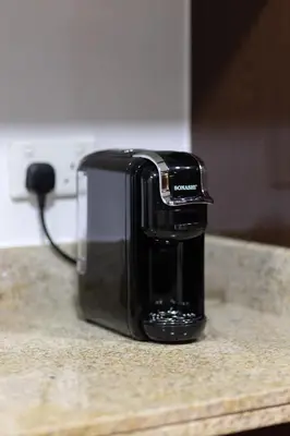 a toaster sitting on top of a counter at Burj and Fountain view 3BR plus maids room in Dubai