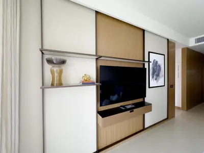 a living room with a flat screen tv in a wall at ADDRESS Residences Opera 2BR Tower 1 - EPIC 30th floor Burj Khalifa view byBLCK with DXB AIRPORT VIP Shuttle option in Dubai