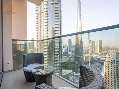 a balcony with a view of a city at Burj Views Elegance from 3 Bedroom Apartment 214-A1-3 in Dubai