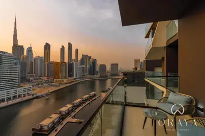 a view of a river from a balcony of a building at Studio With Jaw-Dropping Canal And Burj Views in Dubai