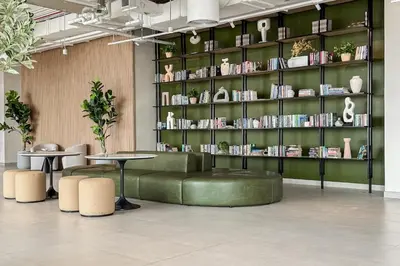 a library with a table and a shelf of books at Airstay - 1BR Haven - Town Square Living - Monthly Offer Available in Dubai