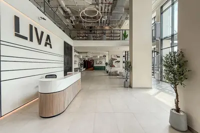 a hallway in a building with a nva sign on the wall at Airstay - 1BR Haven - Town Square Living - Monthly Offer Available in Dubai