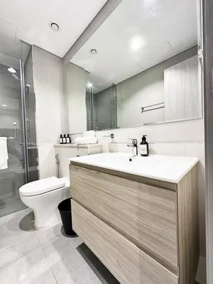 a bathroom with a sink and a toilet at CasaHue - Canal x Burj View - 4Guest - Award Winning in Dubai
