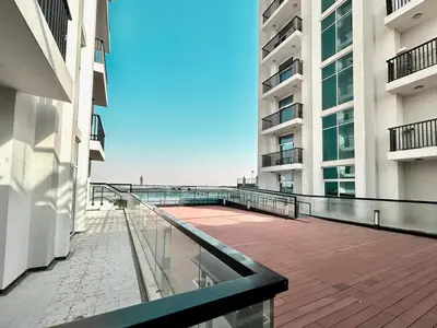 a balcony of a building with a view of the ocean at Homes2Retreat - Glamz Haven Stylish Studio with Balcony in Dubai
