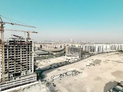 a view of a construction site with buildings and crane at Homes2Retreat - Glamz Haven Stylish Studio with Balcony in Dubai
