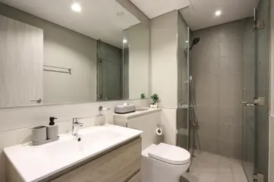 a bathroom with a sink and a toilet and a shower at Stylish 1BR Close to Metro Burj Khalifa & Dubai Canal in Dubai