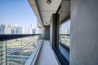 an office building hallway with a view of the city at Elegant Cozy Marina Home in Dubai