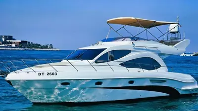 a white boat is sitting in the water at Riviera Leisure Yachts Dubai in Dubai