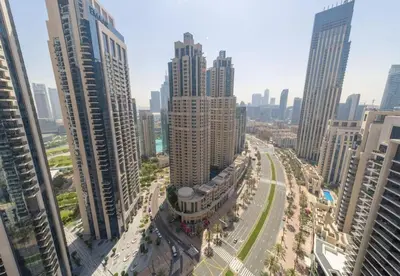 an aerial view of a city with tall buildings at Luxury 3BR Downtown Stay Near Burj in Dubai